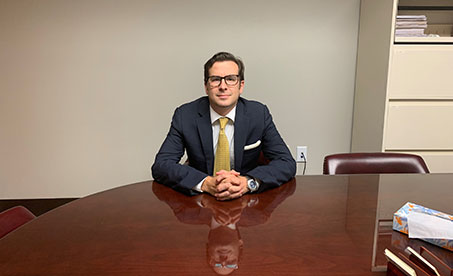 Disability Lawyer Chris Monterosso sitting at a conference table